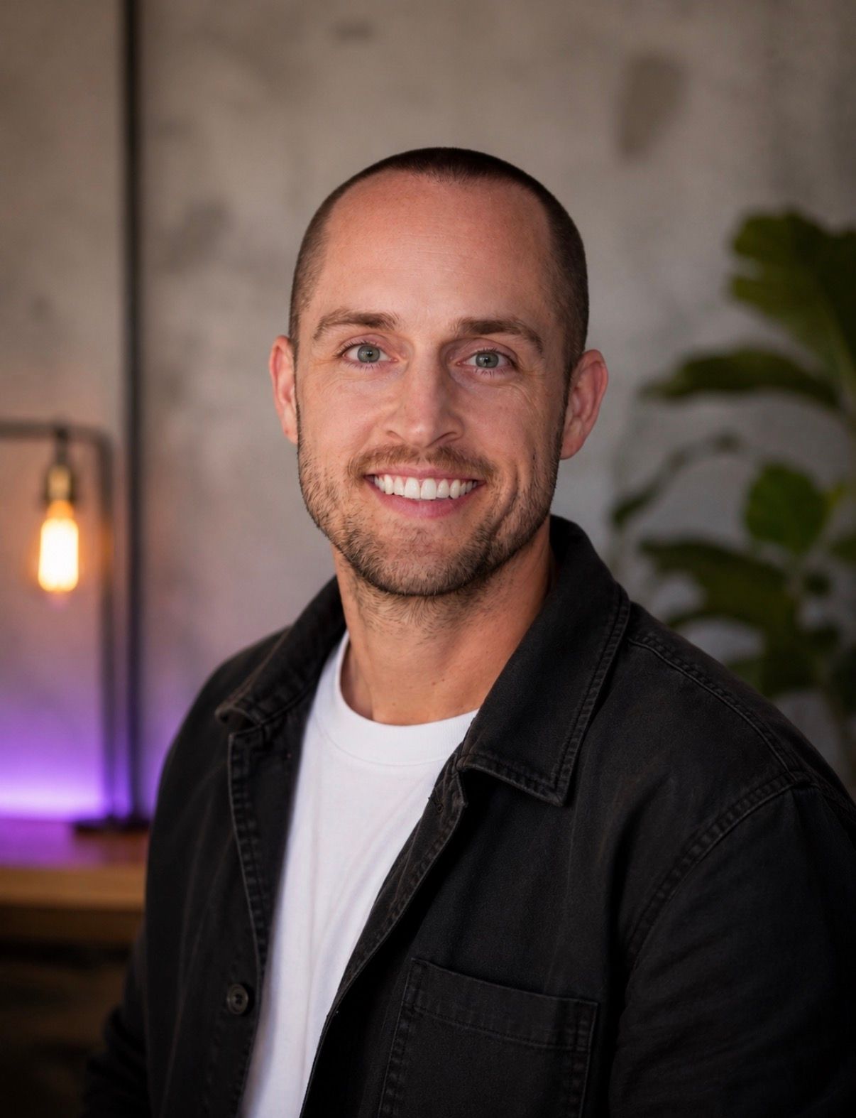 Keegan Gunnlaugsson, smiling, in a dark work jacket